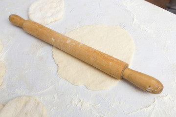 rolling dough with a rolling pin