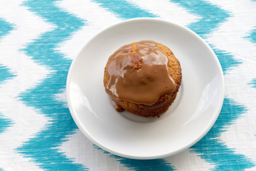 Cake at plate on striped background. Top view.