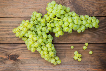 Sultan Grapes on a wooden background. Close-up. Selective focus