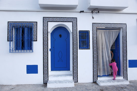 Young child and quayside house in the Old Port, Bizerte, Tunisia