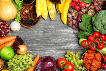 Fruits and vegetables on wooden background