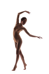 Fototapeta na wymiar young beautiful dancer in beige swimsuit posing