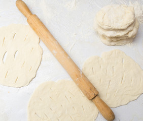 rolling dough with a rolling pin