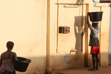 Woman carrying water, Lome, Togo, West Africa