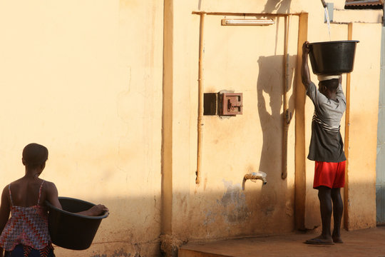 Woman Carrying Water, Lome, Togo, West Africa