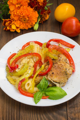 Meat with roasted peppers  pasta and spices on a wooden rustic table