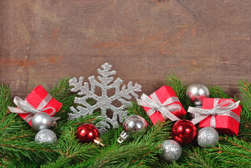 Silver and red Christmas decorations and spruce branch