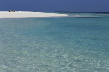 Paradise Island in the ocean. Turquoise water and ultramarine sk