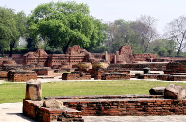 A view of the ruins of old buildings and Buddhist stupas of the ancient city of Sarnath near...