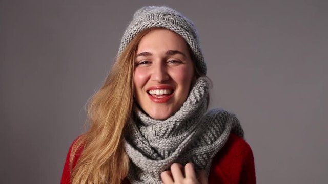 beautiful young woman enjoying wearing warm winter woolen clothes