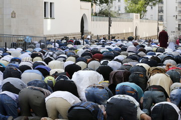 Muslims praying outside the Paris Great Mosque on Eid al-Fitr festival, Paris, France 