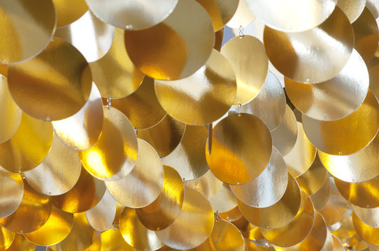decoration of golden shiny circles suspended from the ceiling