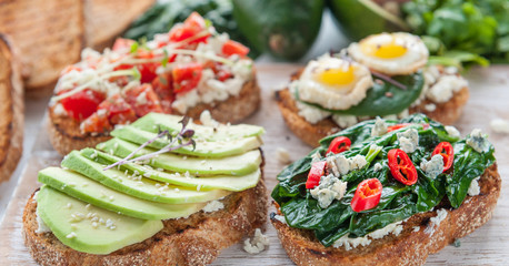 tasty and delicious bruschetta with with vegetables, cheese and micro greens