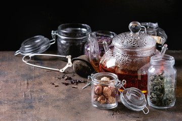 Variety of dry tea with teapot