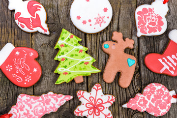 Homemade various christmas gingerbread cookies on wooden background