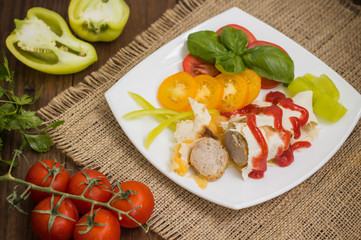 Home sausage in pita bread. Wooden table. Top view. Close-up