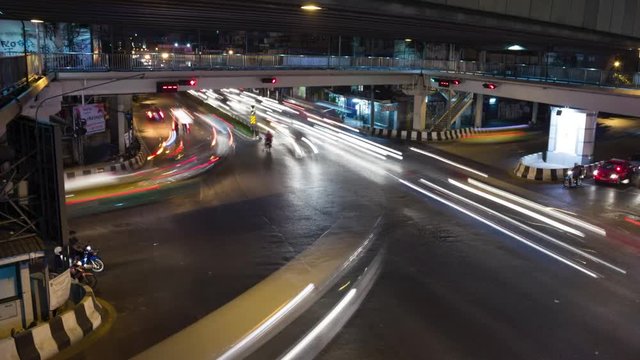 city intersection traffic time lapse in Bangkok Thailand at night