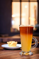 dessert and coffee on table