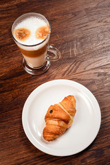 up of coffee and croissant