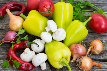 Vegetable set on a wooden background. Top view. Close-up