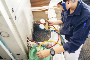 Technician is checking air conditioner