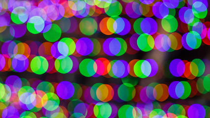 beautiful blurred multicolored lights in the disco
