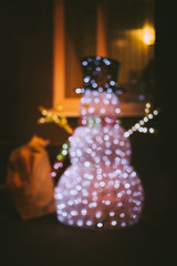Christmas snowman that stands at the window