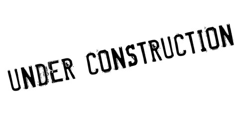 Under construction rubber stamp. Grunge design with dust scratches. Effects can be easily removed for a clean, crisp look. Color is easily changed.