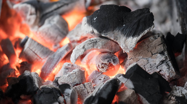 Blazing charcoal in he stove.
