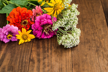 Wild flowers on a wooden background