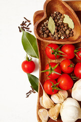 tomatoe, garlic, pepper, bay leaves top view Space for text