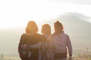Woman arms mountain air force sunlight morning haze.