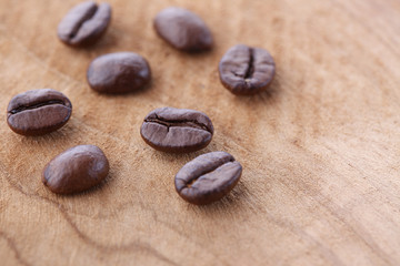 Coffee beans on rustic wooden background