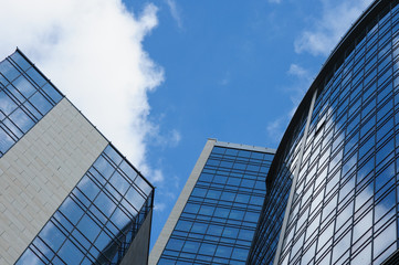 Fototapeta na wymiar multistory glass office building on a background of the sky