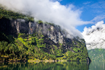 Cliff with cloud at Geirangerfjord in Norway