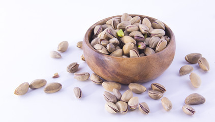 Pistachio nuts on a white table