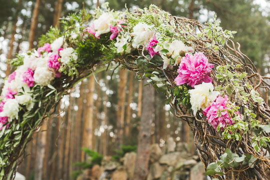 Wedding arch of peonies. Pink and white peonies. Wedding photo concept