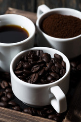 Three types of coffee - ground, grain and beverage, vertical 