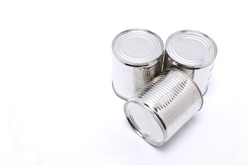 Three tall cans in white background.