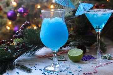 Blue Cocktail on festive holiday background, selective focus