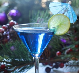 Blue Cocktail on festive holiday background, selective focus