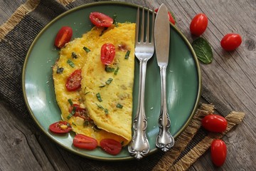 Fluffy Egg omelet with cherry tomatoes