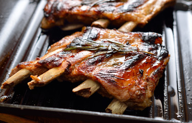 Pork ribs on a grill frying pan