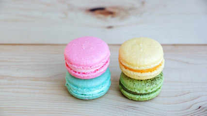 colorful cake macaron or macaroon on wooden background.