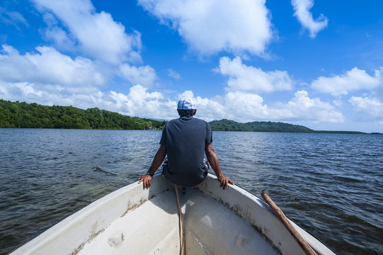 Man sitting on a boat near Nan Madol, Pohnpei Ponape), Federated States of Micronesia, Caroline Islands, Central Pacific 
