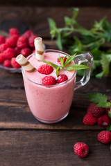 Raspberry yogurt. On a wooden background. Close-up