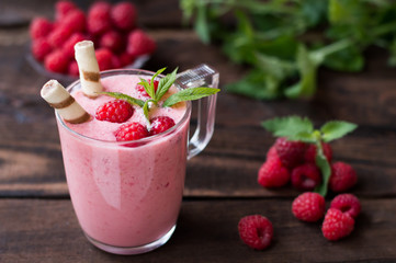 Raspberry yogurt. On a wooden background. Close-up