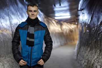 Teenage boy in a salt mine tunnel