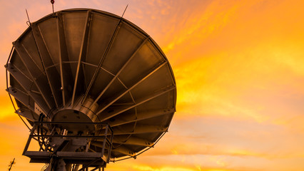Satellite dishe. Sunset sky background