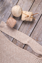 Light skeins of yarn with wooden hooks.